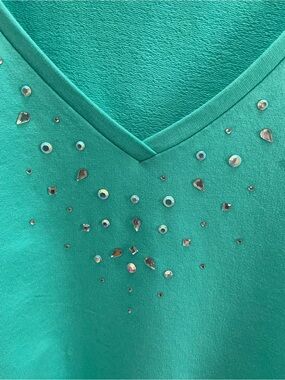 Quacker Factory teal  V-Neck top 
with Sparkling Rhinestones 
on neck & pockets.